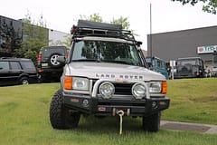 Land Rover with roof top tent and aftermarket lights