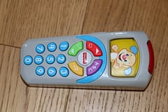 Family Road Trip Activity Ideas For In The Car - toys that make noise and light up help distract babies and preschool age children if getting fussy. Small toys are easiest to travel with like the Fisher Price TV remote control