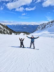 Father and Son Learning to Snowboard