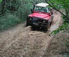 Land Rover Defender battling mud