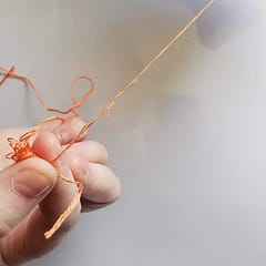 separating floss strand from skein
