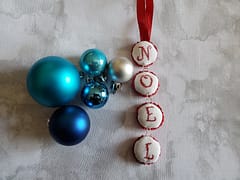 Stitched Cross Stitch Ornament using a Bottle Cap